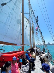 Guests aboard Tall Ship Windy sailing on Lake Michigan